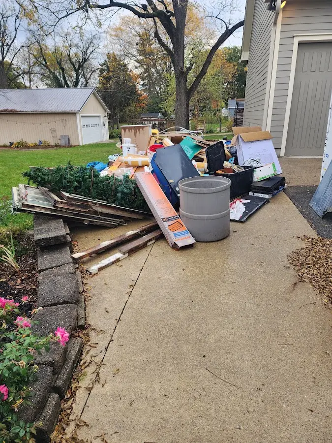 Dumpster being loaded with debris for Commercial Dumpster Rental in Watchung